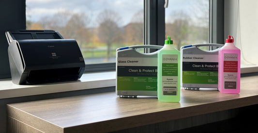 Dyanix Clean and Protect box and Cleaning bottles in front of a canon scanner