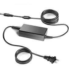 Power adapter with coiled cable on a white background